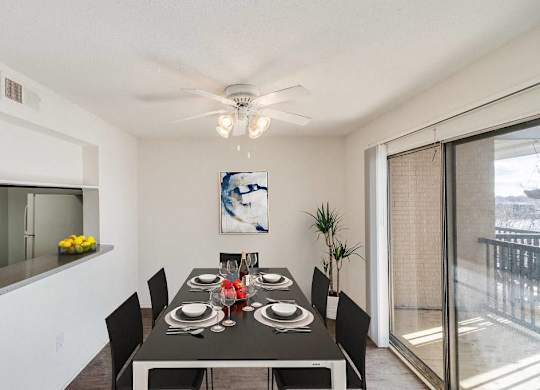 A dining room with a table set for six people at The Waverly on the Lake - Belleville, MI Apartment , Belleville, 95050