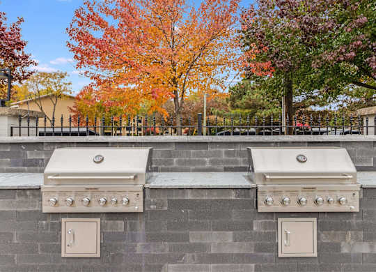 Two grills are built into a wall at The Waverly on the Lake - Belleville, MI Apartment , Belleville, MI