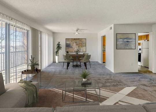 A living room with a couch, a coffee table, and a painting on the wall at The Waverly on the Lake - Belleville, MI Apartment , Michigan