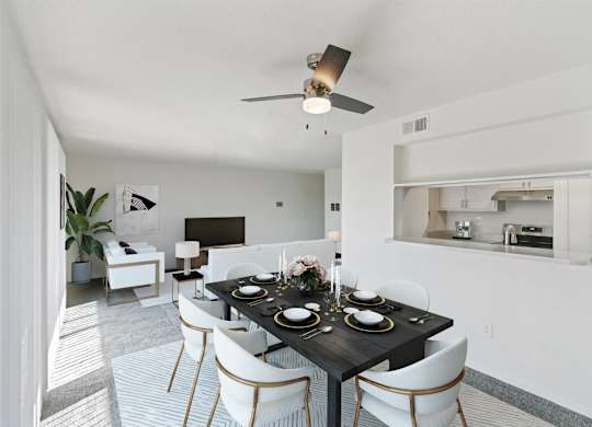 A modern dining room with a black table set for two at The Waverly on the Lake - Belleville, MI Apartment , Belleville, Michigan
