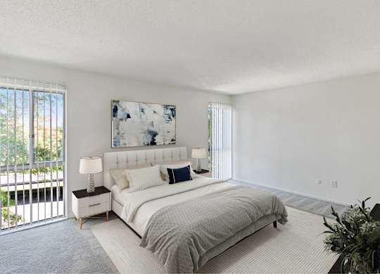 A bedroom with a large bed and a painting on the wall at The Waverly on the Lake - Belleville, MI Apartment , Belleville, 95050
