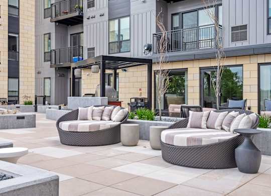 Zen Terrace with Lounge Chairs and Grills at Lilia Apartments in Lilydale, MN 55118