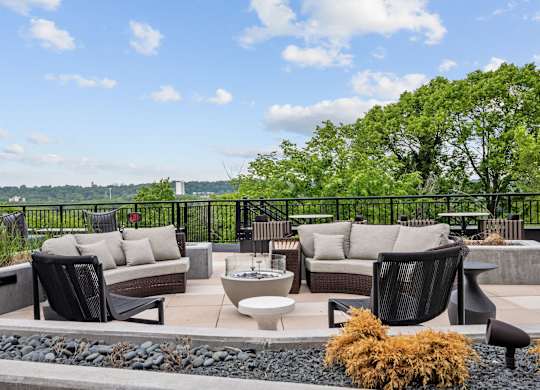 Zen Terrace with Lounge Chairs and Grills at Lilia Apartments in Lilydale, MN 55118