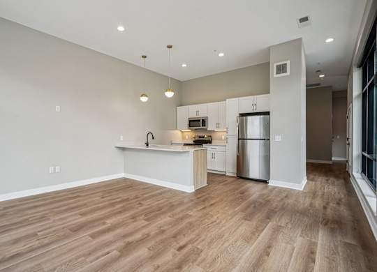 Kitchen with a refrigerator at Expo Apartments, Minnesota