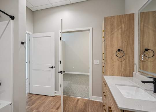 Bathroom with a white sink at Expo Apartments, Minneapolis
