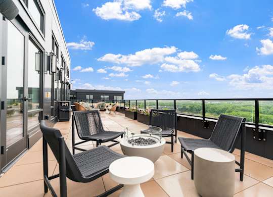 Top floor terrace with seating and fire pits leading from the Parlour and the Tea Room at Lilia in Lilydale, 55118