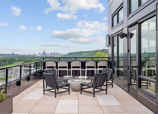 Top Floor Terrace attached to The Parlour and the Tea Room with fire pits and chairs at Lilia Apartments in Lilydale, MN 55118