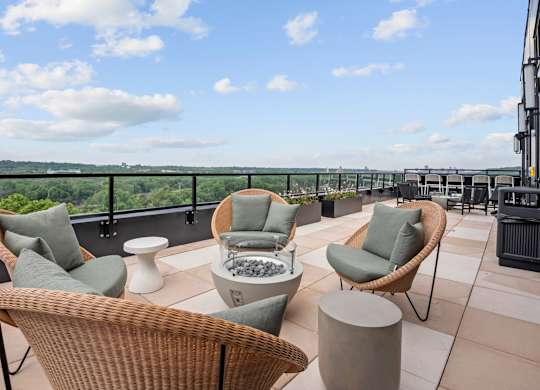 Top Floor Terrace attached to The Parlour and the Tea Room with fire pits and chairs at Lilia Apartments in Lilydale, MN 55118