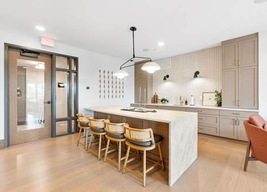 The kitchen in the Clubroom, a reservable community room at Lilia in Lilydale, MN 55118