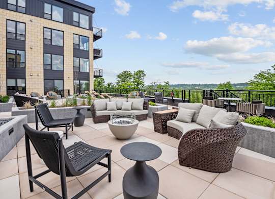 Zen Terrace with Lounge Chairs and Grills at Lilia Apartments in Lilydale, MN 55118