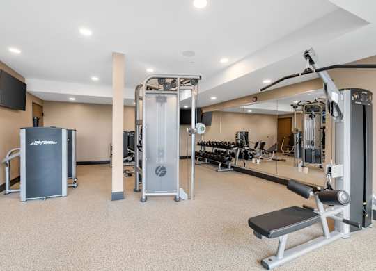 The resort-style luxury 24-hour fitness center at Lilia in Lilydale, MN 55118, with cardio equipment, free weights, and exercise machines.