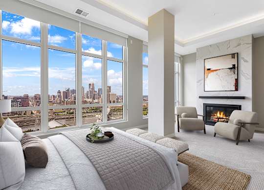 a bedroom with a bed and a view of a city at Expo, Minnesota