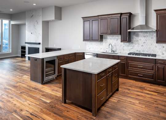a large kitchen with wooden floors and wooden cabinets at Expo, Minneapolis Minnesota