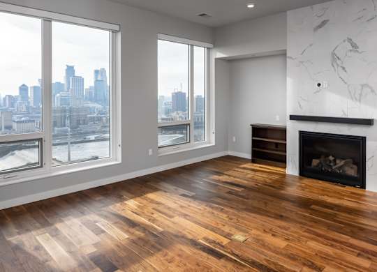a living room with a fireplace and a view of the city at Expo, Minnesota