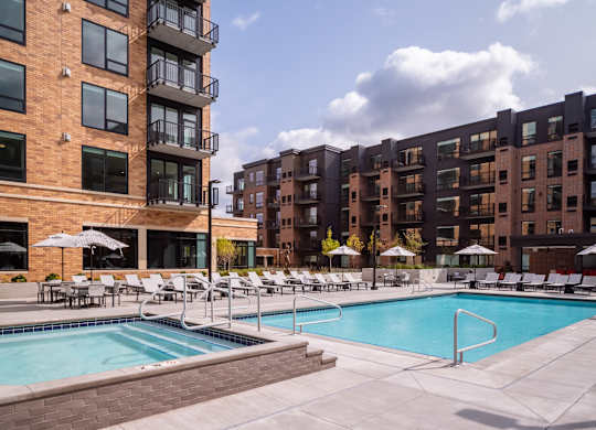 a swimming pool in front of a large apartment building at Expo, Minneapolis Minnesota
