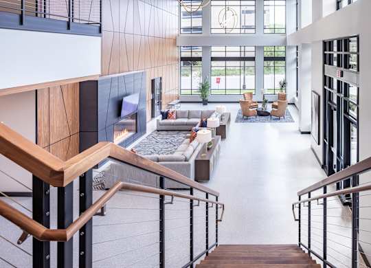 the lobby of an office building with stairs and couches at Expo, Minneapolis, MN 55414