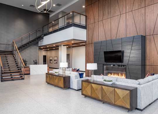 a living room with couches and a fireplace at Expo, Minneapolis, MN 55414