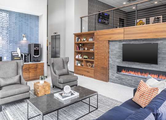 a living room with a fireplace and a tv at Expo, Minneapolis Minnesota