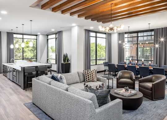 a living room with couches and chairs and a bar and a dining room at Expo, Minneapolis, 55414