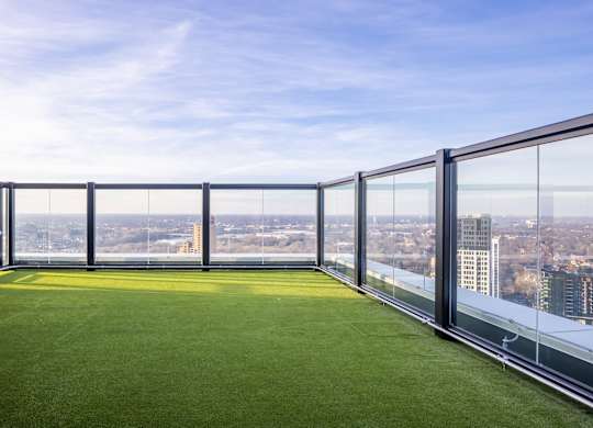 a lawn on the balcony of a skyscraper with a city view at Expo, Minneapolis, MN