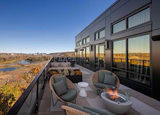 Top floor terrace with seating and fire pits leading from the Parlour and the Tea Room at Lilia in Lilydale, 55118