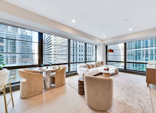 A modern living room with a view of the city. at 17 Market West, Philadelphia, PA