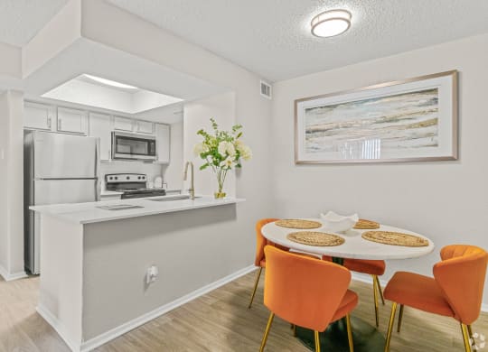 a dining room and kitchen with a table and chairs at District 2308, Arlington, 76011 ?