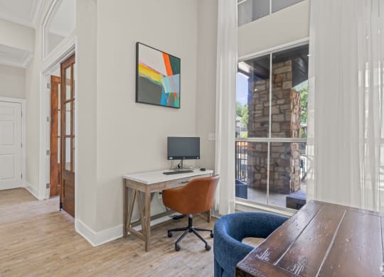 a home office with a desk and a window at District 2308, Texas, 76011
