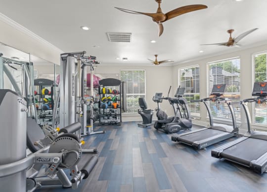 the gym has plenty of cardio equipment and windows at District 2308, Arlington, TX ?