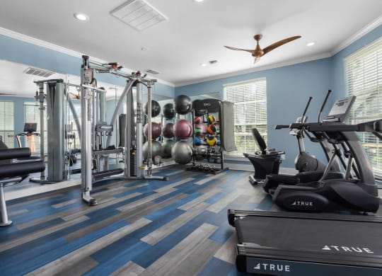 the gym is stocked with weights and cardio equipment at District 2308, Arlington, TX ?