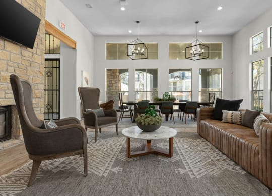 a living room with couches and chairs and a table at District 2308, Arlington Texas?