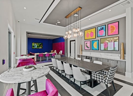 a dining room with a long table and chairs at Altis Grand Kendall, Florida
