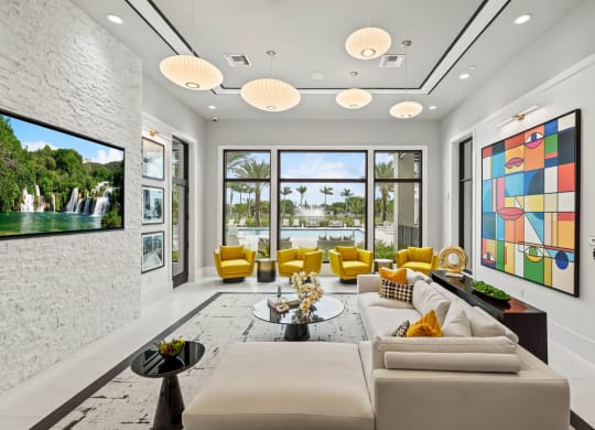 a living room with white walls and yellow furniture and a large window at Altis Grand Kendall, Miami, FL 33186