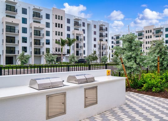 a rendering of an apartment balcony with three stainless steel bunks at Altis Grand Kendall, Miami Florida