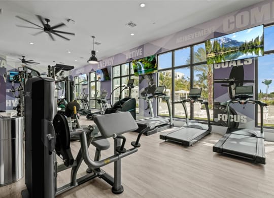 a gym with cardio machines and a view of the beach at Altis Grand Kendall, Miami, 33186