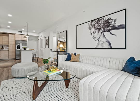 a living room with a white couch and lights on the wall at Altis Grand Kendall, Miami Florida