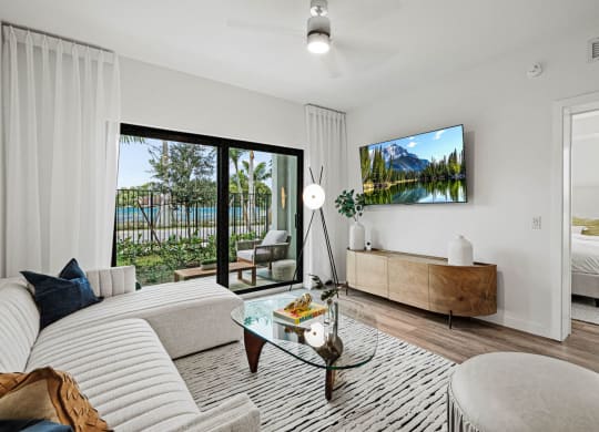 a living room with a couch and a table at Altis Grand Kendall, Miami Florida