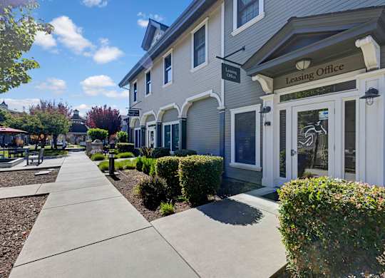 A leasing office is located on the ground floor of a two-story building.
