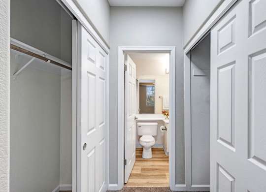 A white bathroom with a toilet and sink.