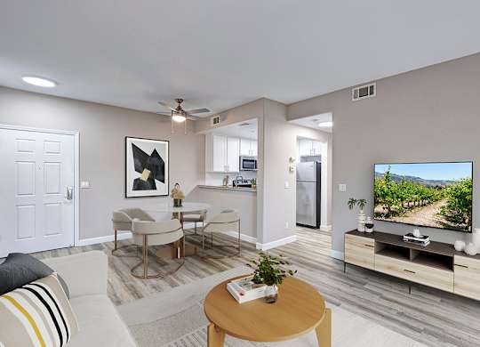 A living room with a television and a couch.