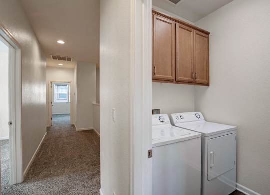 A laundry room with a washer and dryer.