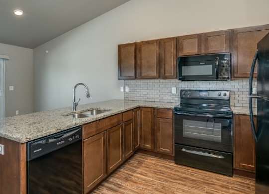 Kitchen with Granite Countertops and Open Concept Living Area