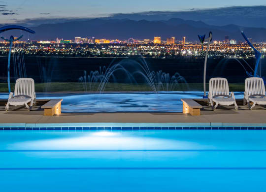 the pool with a view of the city at night