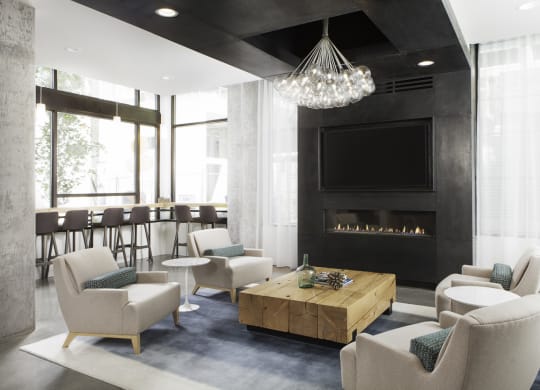 4730 California Apartments The Junction Room with Seating and Television