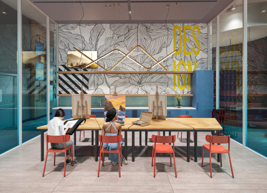 a rendering of people sitting at a table in a room with a colorful wall