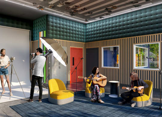 a group of people playing guitars in a room with a recording studio