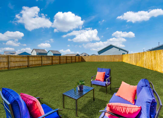 Linea Stillwater Rental Homes Backyard Lawn with Patio Furniture