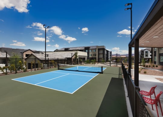 the tennis court at the club at highlands apartments