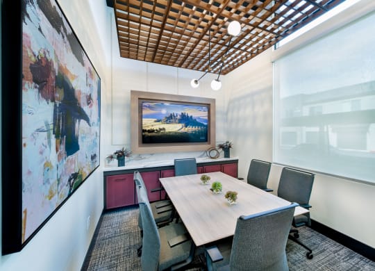 a conference room with a table and chairs
