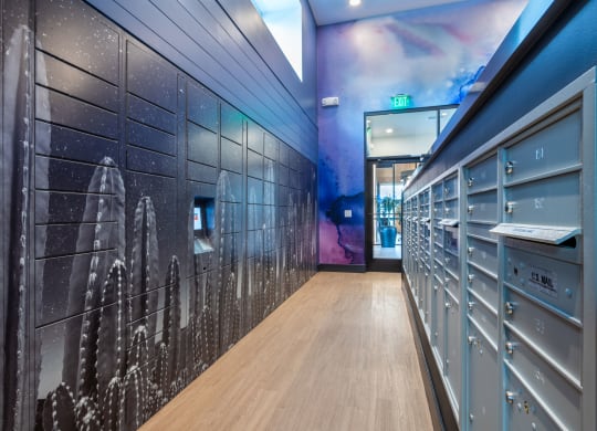a hallway with lockers and a mural of a space shuttle